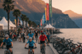 Mountain bikers at FSA Bike Festival along Riva del Garda lakefront with mountain backdrop